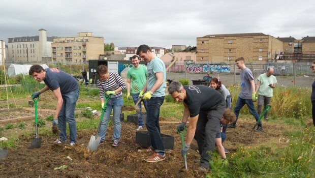 Workday volunteers clear the new potato bed at Bridgefoot Street Community Garden. Photo: Robert Moss